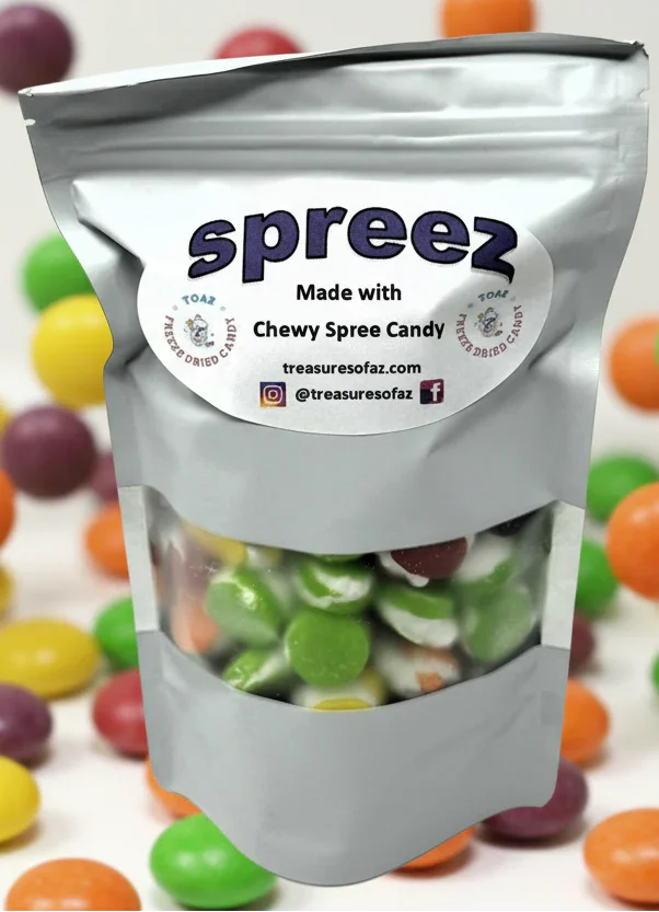 Bag of freeze-dried chewy Spree candy with colorful candy pieces in background