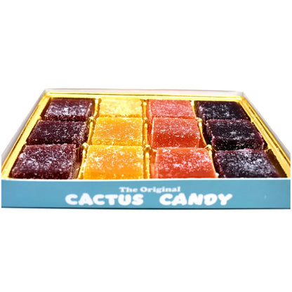 Assorted colorful cactus candy squares in a blue box, sugar-coated desert fruit treats