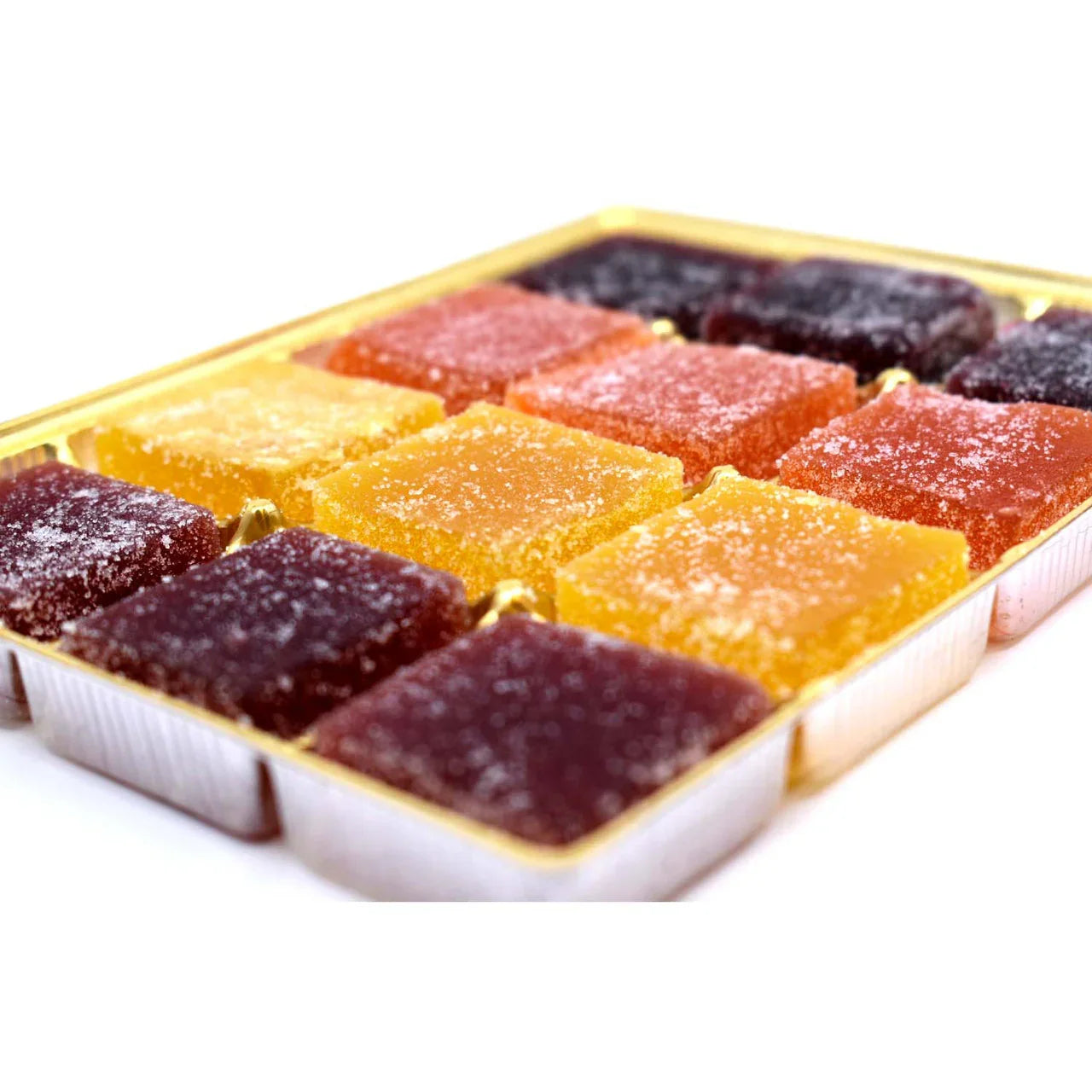 Assorted sugar-coated fruit jelly candies in a gold tray, colorful chewy sweets