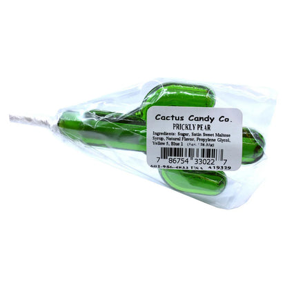 Green cactus-shaped prickly pear lollipop in clear packaging with ingredient label.