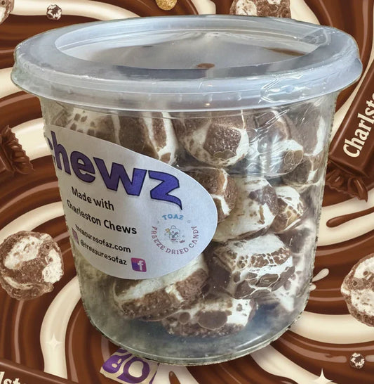 Container of freeze-dried Charleston Chews candy with chocolate and marshmallow pieces